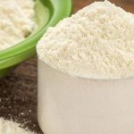 Albumin powder in measuring cup